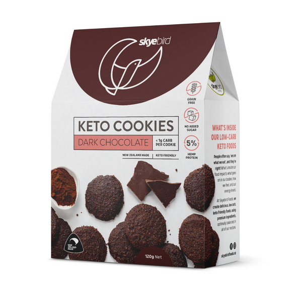 Picture shows box of dark chocolate keto cookies with a number of dark chocolate keto cookies on the front of the package with a Skyebird Foods company logo with a brown background on the front of the box of keto cookies. There's a prominent NZ made icon at the bottom of the keto cookie box to show the keto cookies are nz made. 